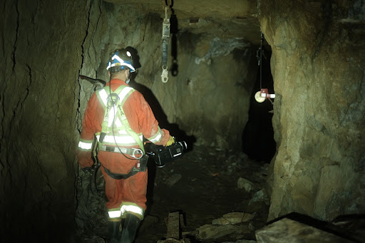 miner walking in underground mine